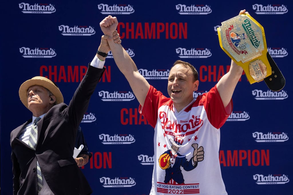 Joey Chestnut celebrates his 15th championship title during the 2022 Nathan’s Famous Fourth of July hot-dog eating contest on Coney Island in New York, in July 2022. Photo: AFP Joey Chestnut celebrates his 15th championship title during the 2022 Nathan’s Famous Fourth of July hot-dog eating contest on Coney Island in New York, in July 2022. Photo: AFP