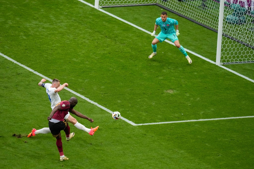 Belgium’s Romelu Lukaku, bottom, challenges Slovakia’s goalkeeper Martin Dubravka during a Group E match in Frankfurt, Germany on Monday. Photo: AP Belgium’s Romelu Lukaku, bottom, challenges Slovakia’s goalkeeper Martin Dubravka during a Group E match in Frankfurt, Germany on Monday. Photo: AP