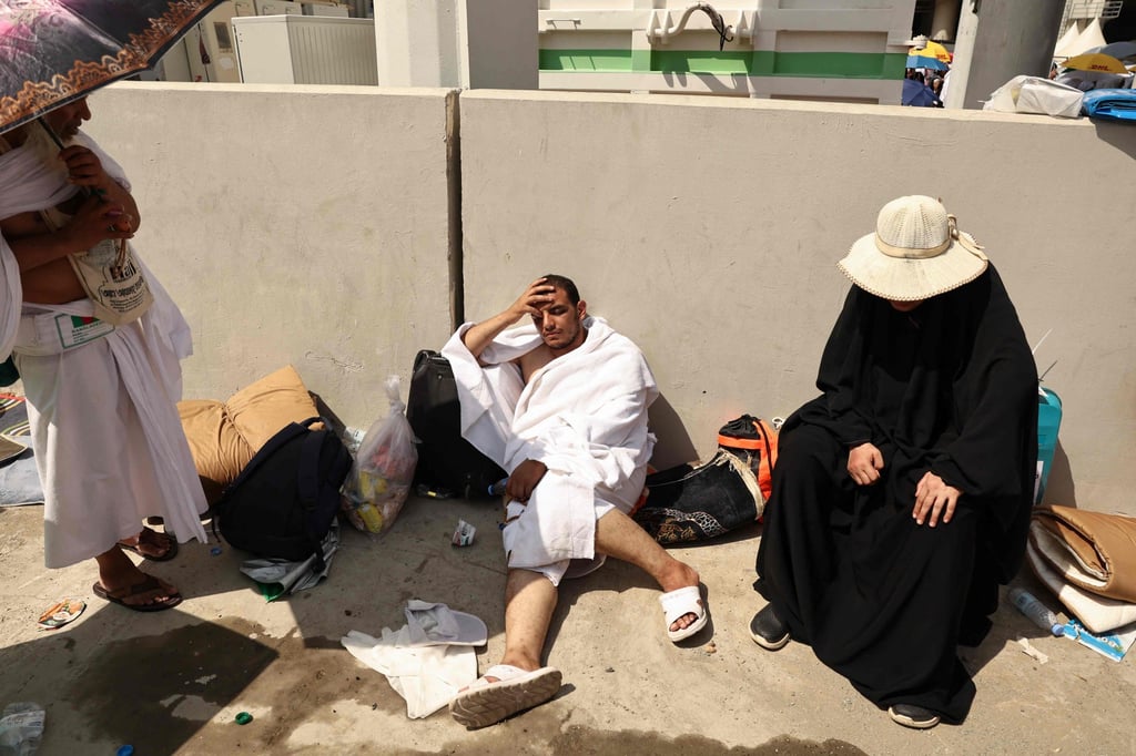 A man effected by the scorching heat rests as Muslim pilgrims arrive to perform the symbolic ‘stoning of the devil’ ritual as part of the haj pilgrimage. Photo: AFP A man effected by the scorching heat rests as Muslim pilgrims arrive to perform the symbolic ‘stoning of the devil’ ritual as part of the haj pilgrimage. Photo: AFP