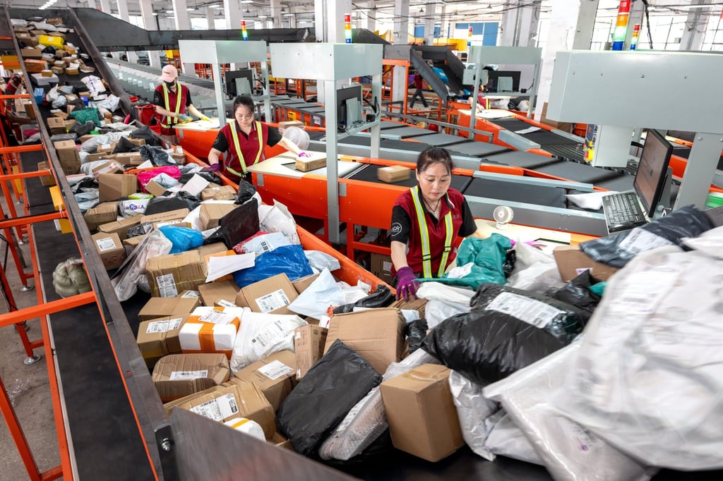 Workers sort parcels at an express logistics company in Huzhou, eastern Zhejiang province, on June 18, 2024. Photo: Xinhua