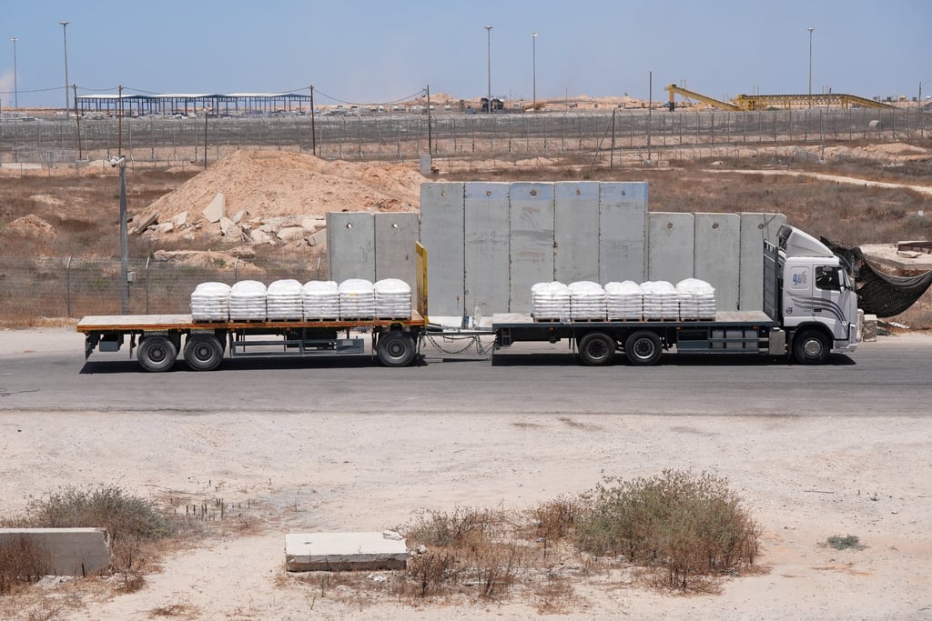 A truck carrying aid for delivery into Gaza drives through the Kerem Shalom crossing in southern Israel on June 17. Photo: Reuters A truck carrying aid for delivery into Gaza drives through the Kerem Shalom crossing in southern Israel on June 17. Photo: Reuters
