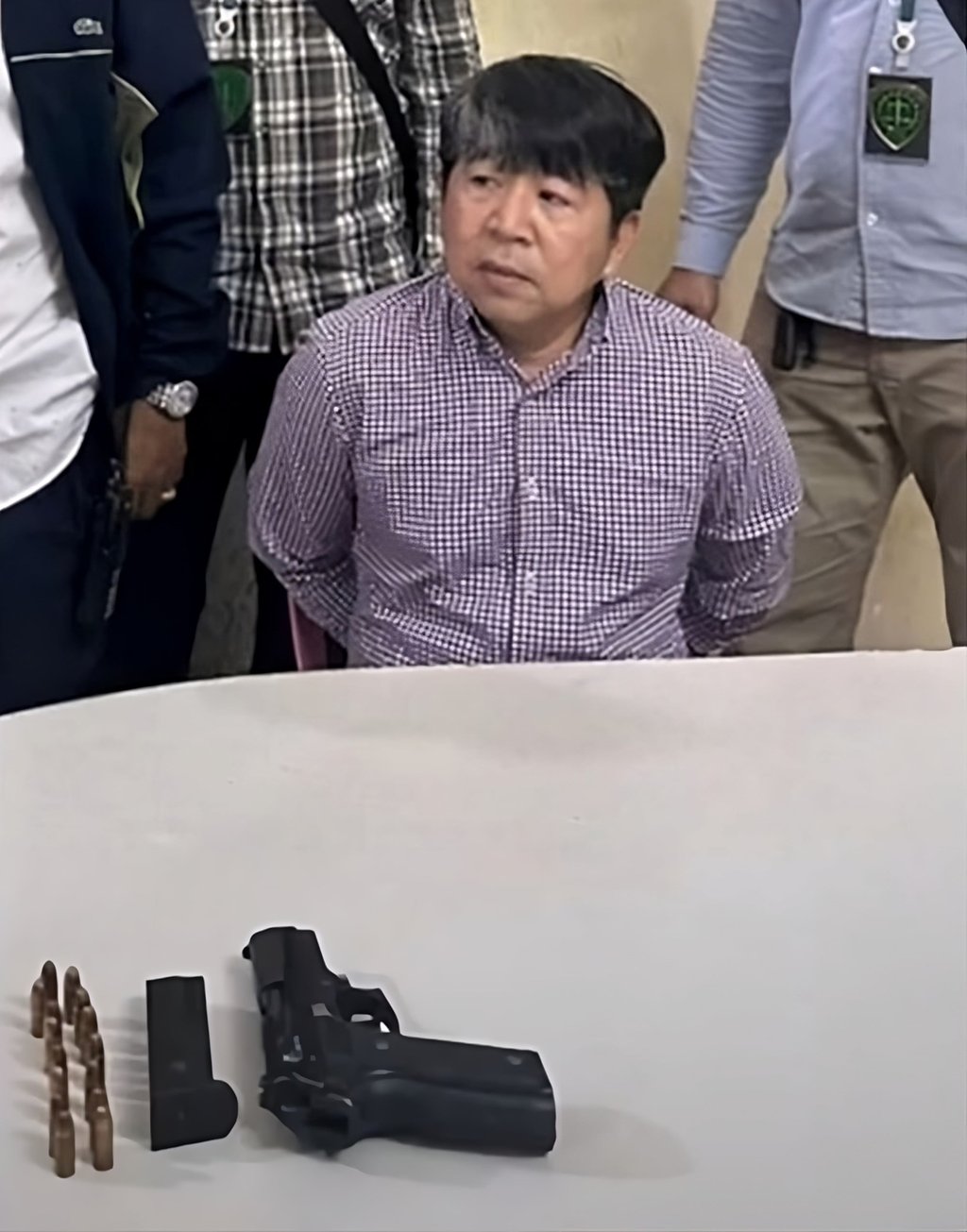 Shooting suspect Srey Sina, 50, had his Oknha title revoked after his arrest. Photo: YouTube/Kampuchea-TV Shooting suspect Srey Sina, 50, had his Oknha title revoked after his arrest. Photo: YouTube/Kampuchea-TV