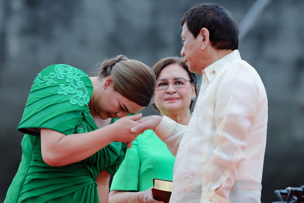 Duterte-Carpio greets her father, outgoing President Rodrigo Duterte, during her inauguration as vice-president in June 2022 Photo: Presidential Photographers Division/Handout via EPA-EFE Duterte-Carpio greets her father, outgoing President Rodrigo Duterte, during her inauguration as vice-president in June 2022 Photo: Presidential Photographers Division/Handout via EPA-EFE