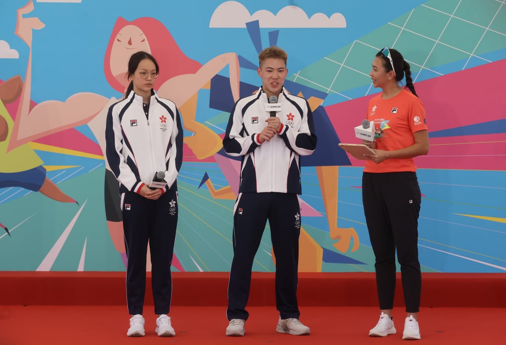 Swimmer Cindy Cheung and shuttler Lee Cheuk-yiu model Hong Kong’s Games tracksuits. Photo: Jonathan Wong
