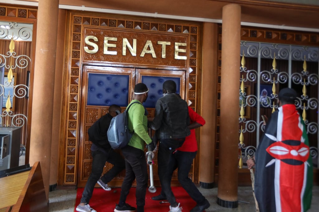 Demonstrators try to breach a door at the parliament building in Nairobi, Kenya. Photo: EPA-EFE