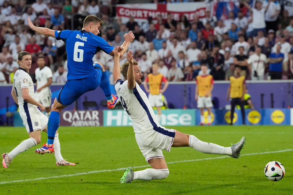 England’s Harry Kane (right) and Slovenia’s Jaka Bijol fight for the ball in Cologne. Photo: AP England’s Harry Kane (right) and Slovenia’s Jaka Bijol fight for the ball in Cologne. Photo: AP