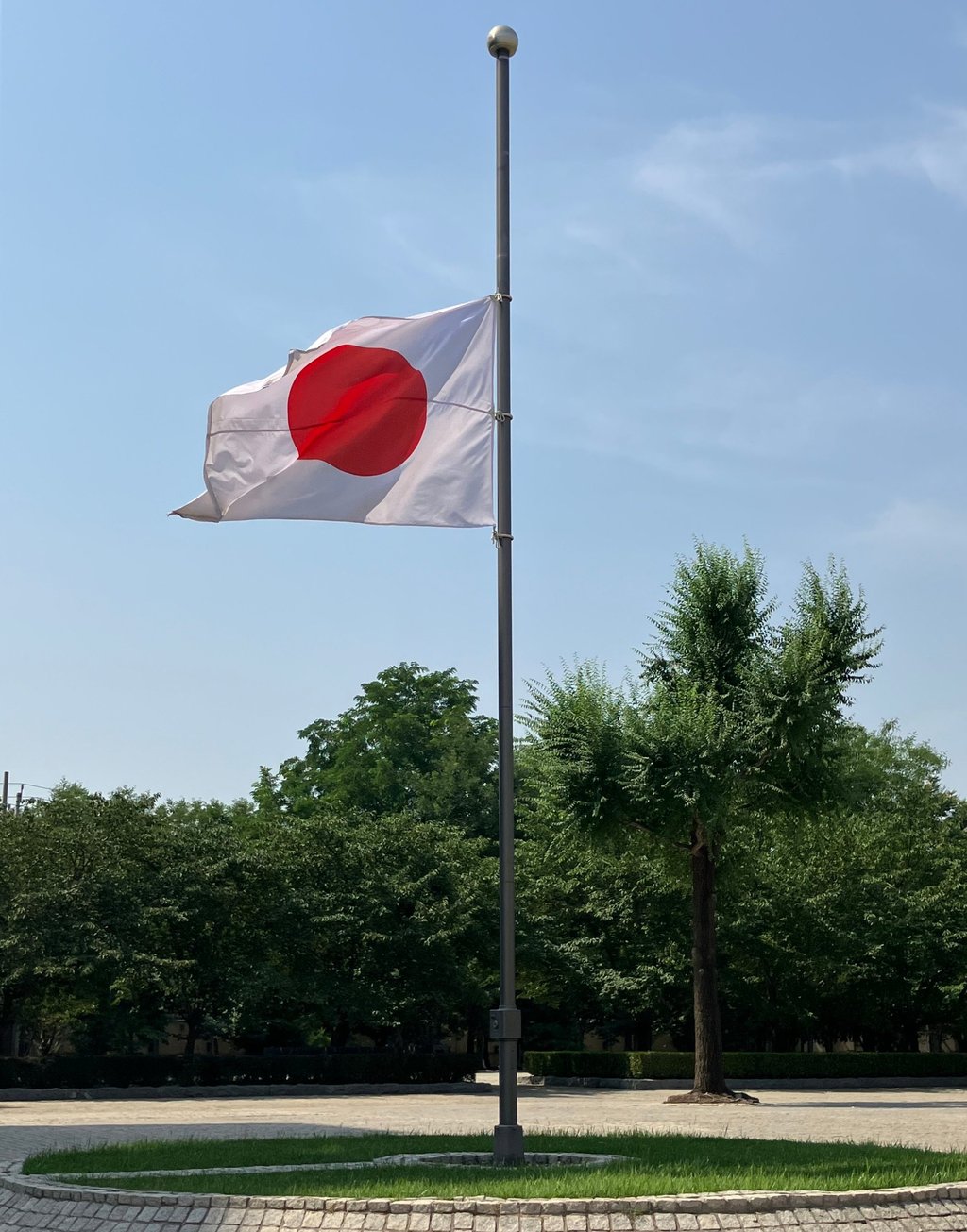 The Japanese embassy in Beijing lowered its flag to half-mast on Friday morning in honour of Chinese woman Hu Youping, who died days after trying to stop a knife attack against a Japanese mother and son. Photo: X/Japan_Emb_inCN