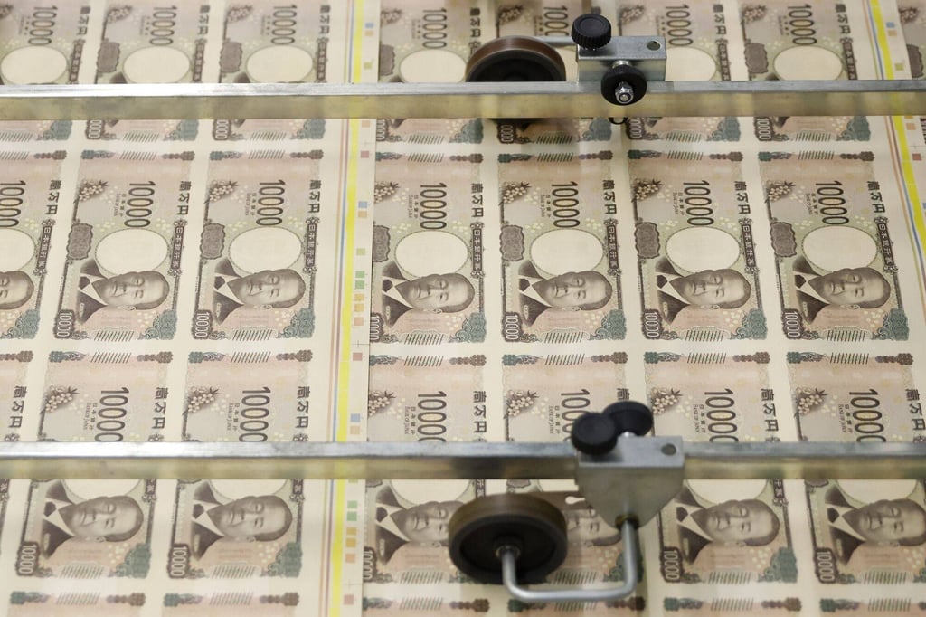 Sheets of newly-designed Japanese 10,000 yen banknotes move through a machine at the National Printing Bureau Tokyo plant in Tokyo. Photo: Bloomberg Sheets of newly-designed Japanese 10,000 yen banknotes move through a machine at the National Printing Bureau Tokyo plant in Tokyo. Photo: Bloomberg