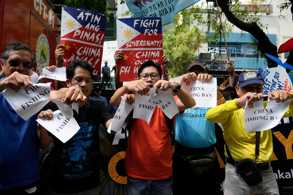 Activists tear paper to symbolise their protest near the Chinese consulate in Makati, Philippines on June 14, 2024. The group is protesting against the continued aggression of China at the disputed South China Sea. Photo: AP Activists tear paper to symbolise their protest near the Chinese consulate in Makati, Philippines on June 14, 2024. The group is protesting against the continued aggression of China at the disputed South China Sea. Photo: AP