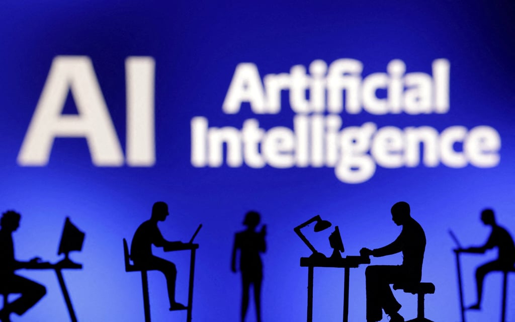 Figurines with computers and smartphones are seen in front of the words ‘AI Artificial Intelligence’ in this illustration photo taken February 19, 2024. Photo: Reuters
