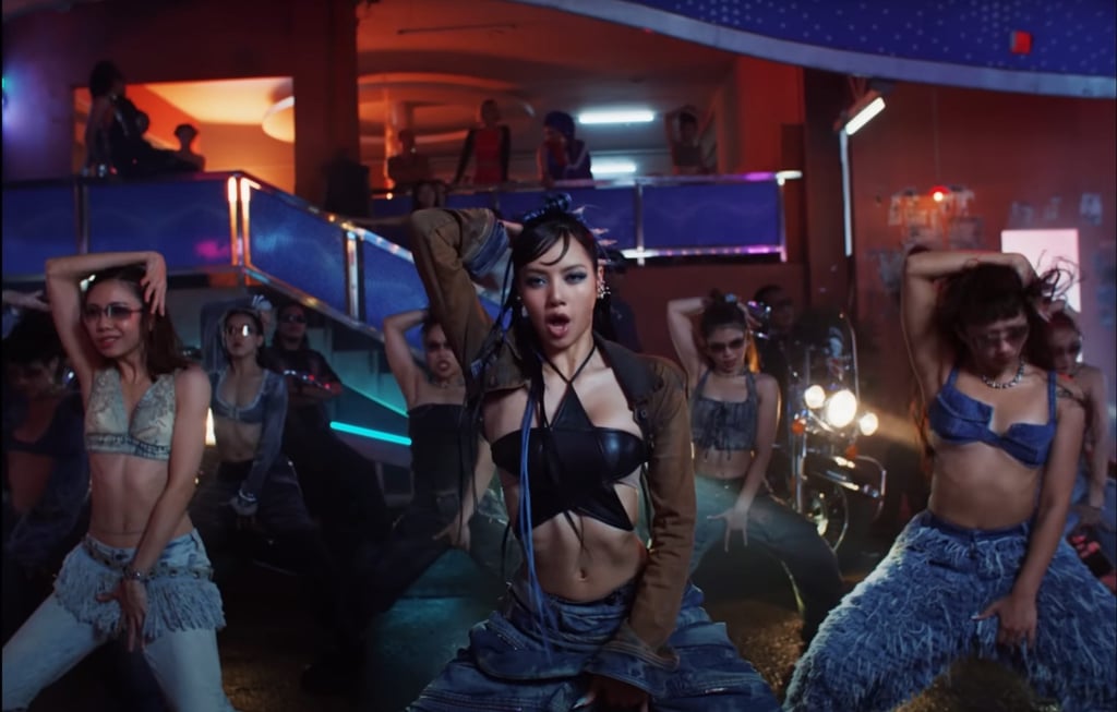 Lisa fronts a group of dancers during the music video shoot in Bangkok’s Chinatown. Photo: YouTube/LLOUD Official Lisa fronts a group of dancers during the music video shoot in Bangkok’s Chinatown. Photo: YouTube/LLOUD Official