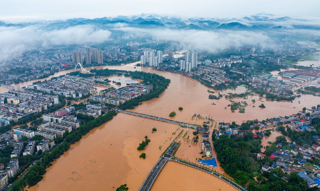 Pingjiang county has been inundated after heavy rains. Photo: Xinhua