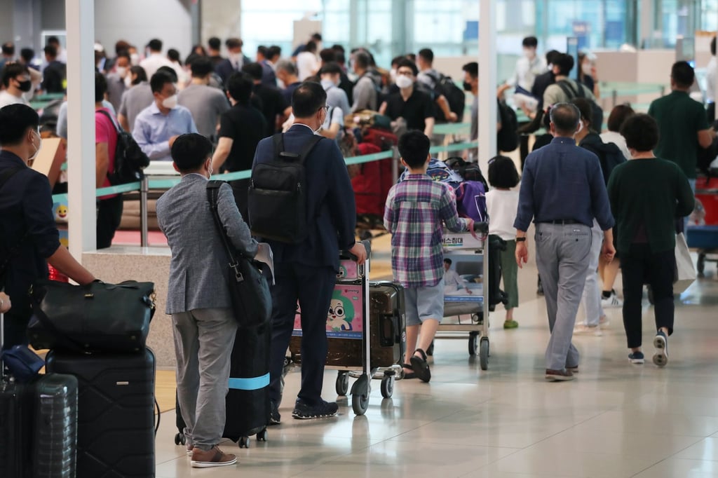 South Koreans queue in the departure lobby of Incheon airport. The North’s balloons briefly forced a three-hour halt to flights at the airport on June 26. Photo: Yonhap via EPA-EFE
