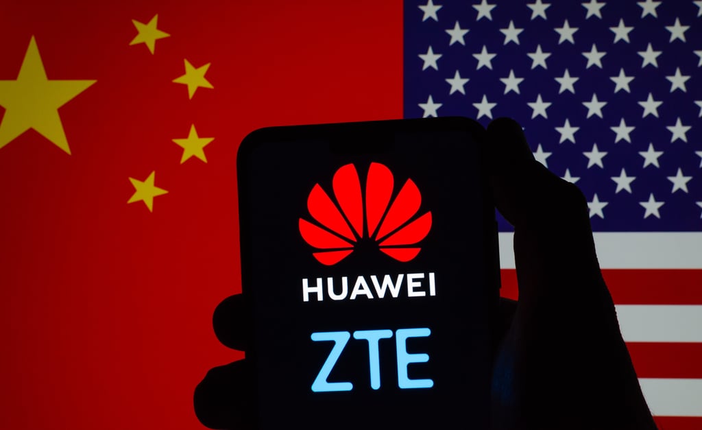 Huawei and ZTE logos on a mobile phone screen with flags of China and the US in the background. Photo: Shutterstock