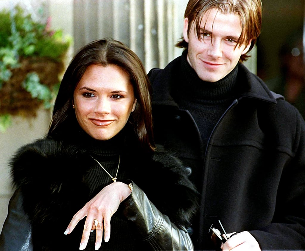 Victoria Beckham, then Victoria Adams, and David Beckham show off her engagement ring after announcing their engagement in 1998. Photo: Getty Images