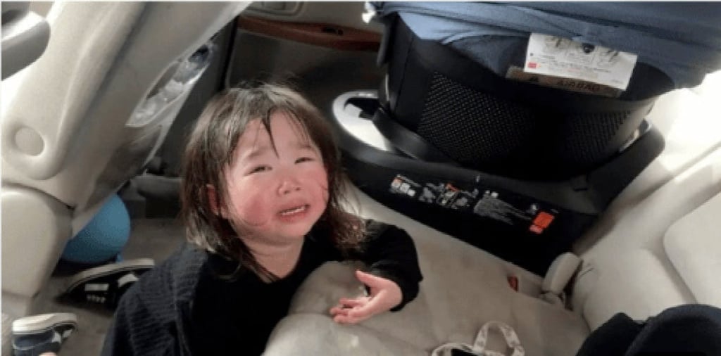 It is believed that the clearly upset little girl was left inside the car for more than half an hour. Photo: YouTube