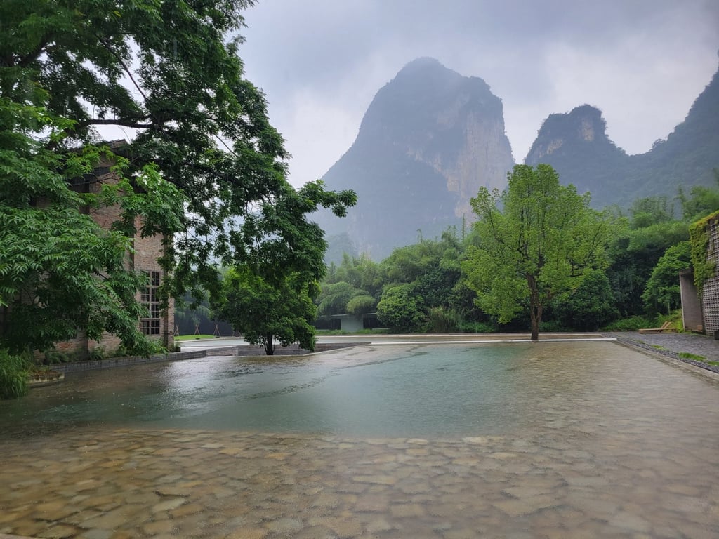 The mountains surrounding the Yangshuo Sugar House help give the resort the feel of a secret hideaway. Photo: Kristian Odebjer The mountains surrounding the Yangshuo Sugar House help give the resort the feel of a secret hideaway. Photo: Kristian Odebjer