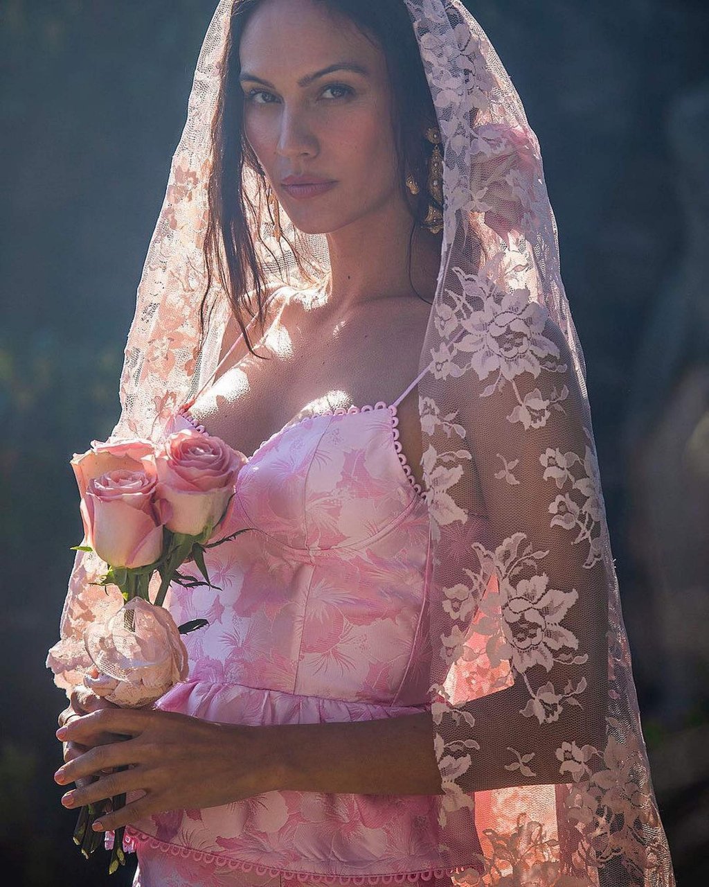 Rachelle Goulding posts for a promotional campaign in a pink gown and veil. Photo: @rachellegoulding/Instagram