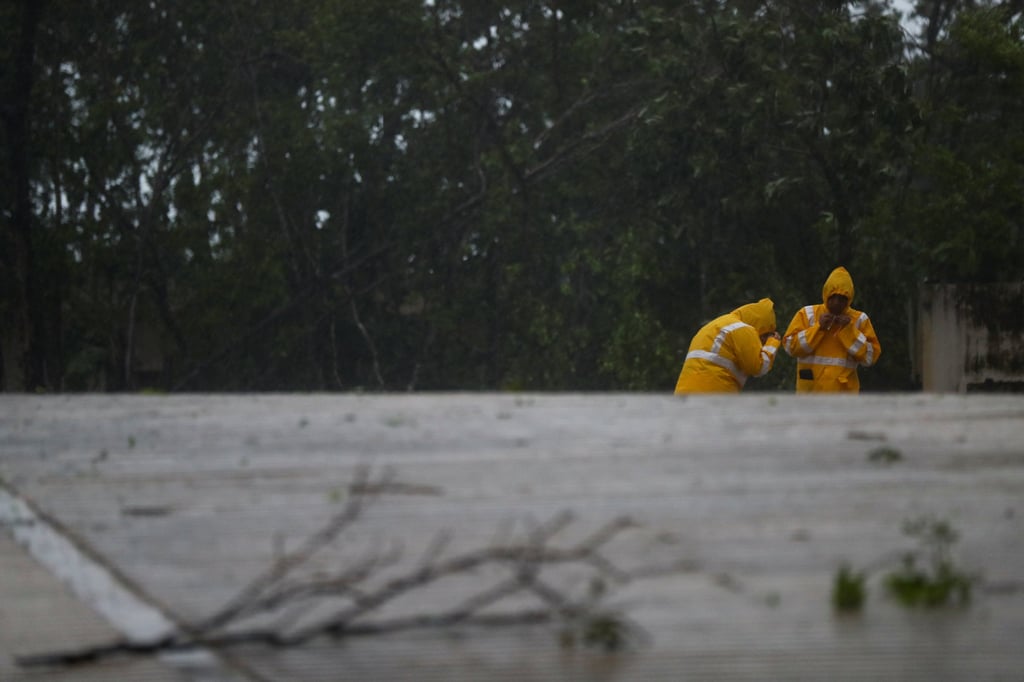 Geographers in Mexico take measurements early on Friday as Hurricane Beryl made landfall in some of the nation’s top tourist destinations. Photo: Reuters