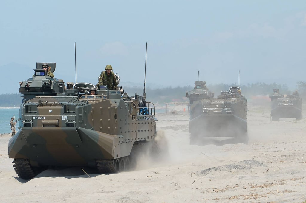 Japanese troops ride amphibious assault vehicles during a joint landing exercise with Philippine and US troops. Photo: AFP Japanese troops ride amphibious assault vehicles during a joint landing exercise with Philippine and US troops. Photo: AFP