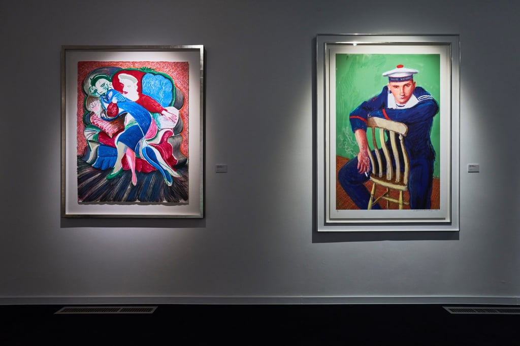 An Image of Celia, State I (left), a lithograph on paper made by Hockney in 1986, and a signed digital print of Matelot Kevin Druez 2 (2009), on show at David Hockney: Paper Trails. Photo: MAM