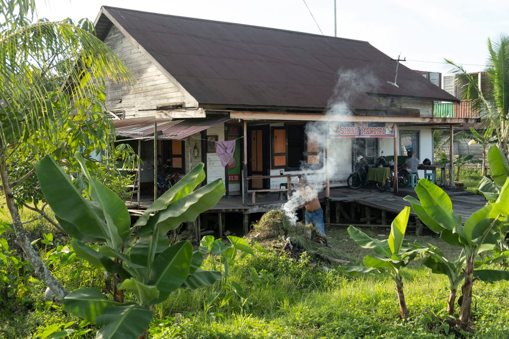 A house on the banks of the Berau River. Photo: Oliver Raw
