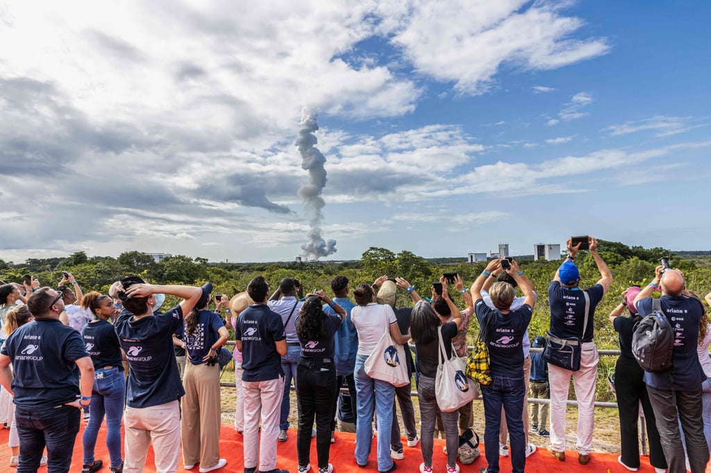 Spectators watch the launch. Photo: AFP
