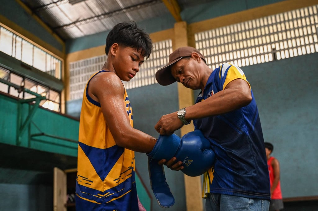 Children as young as 10 go to the Bago gym to search for a way out of poverty. Photo: AFP Children as young as 10 go to the Bago gym to search for a way out of poverty. Photo: AFP