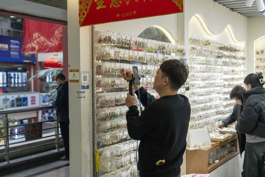 A live-streamer showcases products in a shop at Yiwu International Trade City in Yiwu, China, on March 1, 2024. China’s top leadership has pledged to meet economic targets for the year, avoid risks and maintain social stability, underscoring concern for a recovery hampered by a prolonged property crisis and deflation. Photo: Bloomberg A live-streamer showcases products in a shop at Yiwu International Trade City in Yiwu, China, on March 1, 2024. China’s top leadership has pledged to meet economic targets for the year, avoid risks and maintain social stability, underscoring concern for a recovery hampered by a prolonged property crisis and deflation. Photo: Bloomberg