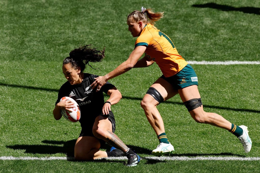 Portia Woodman-Wickliffe scores against arch-rivals Australia at the World Rugby Sevens finals in Madrid. Photo: AFP Portia Woodman-Wickliffe scores against arch-rivals Australia at the World Rugby Sevens finals in Madrid. Photo: AFP