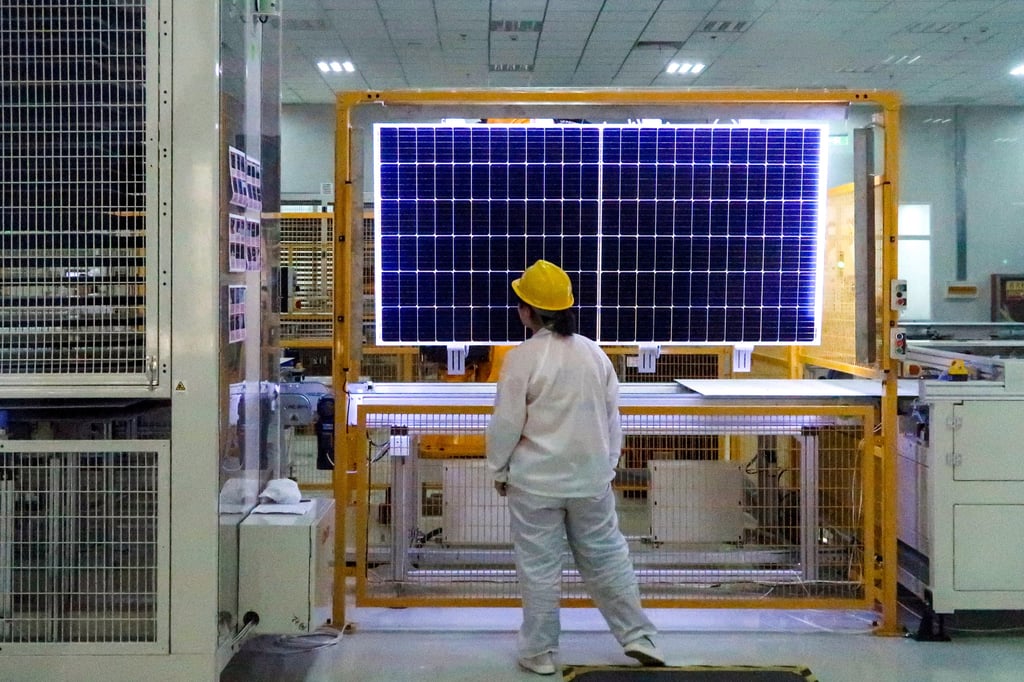 A worker conducts quality-check of a solar module product at a factory of a monocrystalline silicon solar equipment manufacturer LONGi Green Technology Co, in Xian, Shaanxi province, China December 10, 2019. Photo: Reuters