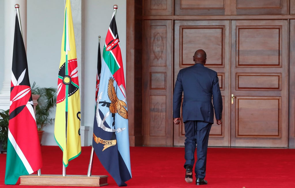 Kenya’s President William Ruto walks away after addressing the nation after he dissolved his entire cabinet apart from the foreign minister in the wake of nationwide protests over new taxes. Photo: Reuters Kenya’s President William Ruto walks away after addressing the nation after he dissolved his entire cabinet apart from the foreign minister in the wake of nationwide protests over new taxes. Photo: Reuters