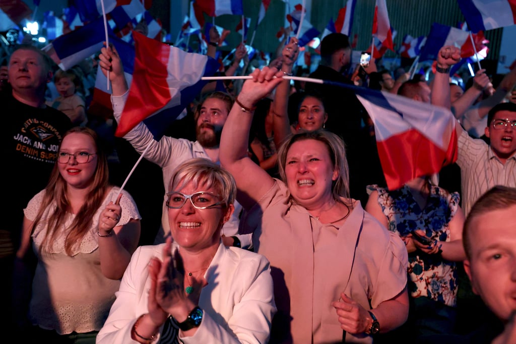 Supporters of Marine Le Pen’s far-right National Rally, with its Eurosceptic, anti-immigration agenda, celebrate after partial results in the first round of the early French parliamentary elections, in Henin-Beaumont, France on June 30. Photo: Reuters