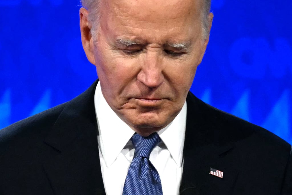 US President Joe Biden looks down as he participates in the first presidential debate of the 2024 elections with former president and Republican presidential candidate Donald Trump. Photo: AFP/Getty Images/TNS