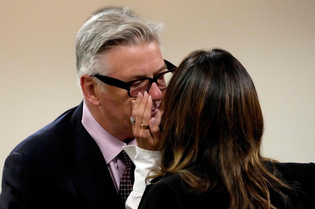 Actor Alec Baldwin interacts with wife Hilaria Baldwin during a break in his hearing in Santa Fe County District Court in New Mexico on Wednesday. Photo: AFP