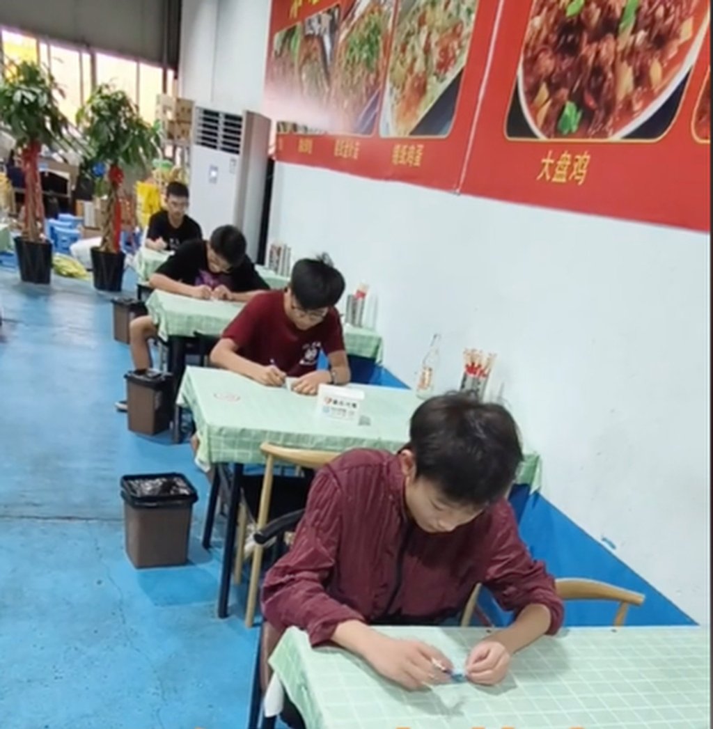 The waiters take the test after their boss discovered they were struggling to take orders. Photo: Douyin
