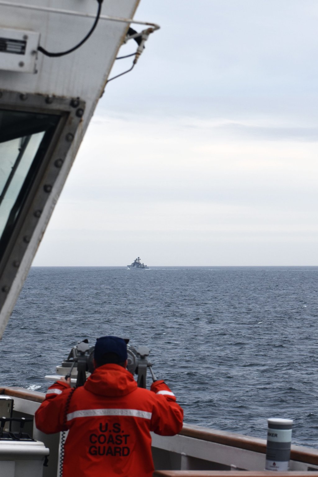 A crew member on the US Coastguard Cutter Kimball observes a foreign vessel in the Bering Sea in September 2022. Photo: US coastguard