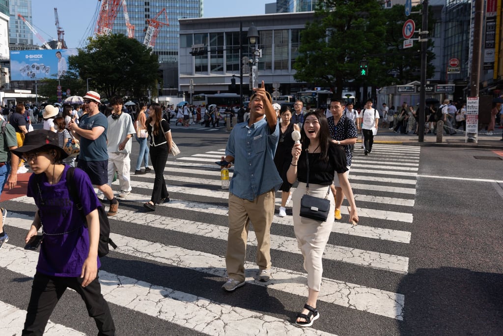 A couple in Tokyo’s Shibuya. The Tokyo metropolitan government is introducing a matchmaking app that uses AI to help partner people up and combat the nation’s sliding fertility rates. Photo: Getty Images