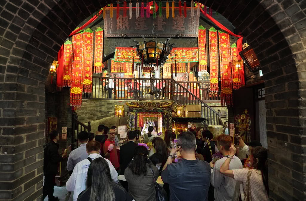 Worshippers pray for good fortune and wealth during the Kwun Yum Treasury Opening Festival at Lin Fa Kung, Tin Hau, on March 6, 2024. Photo: Elson Li