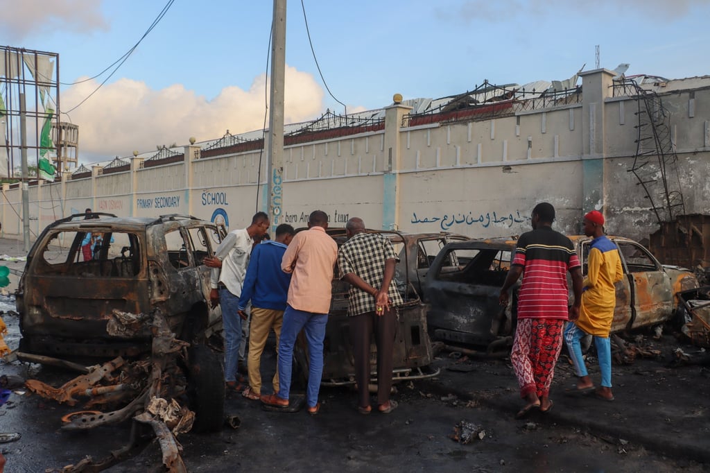 The aftermath of a bomb attack in Mogadishu outside popular Top Coffee restaurant, which is located near the presidential palace in the centre of the city, was thronged with young men watching the final. Photo: EPA-EFE