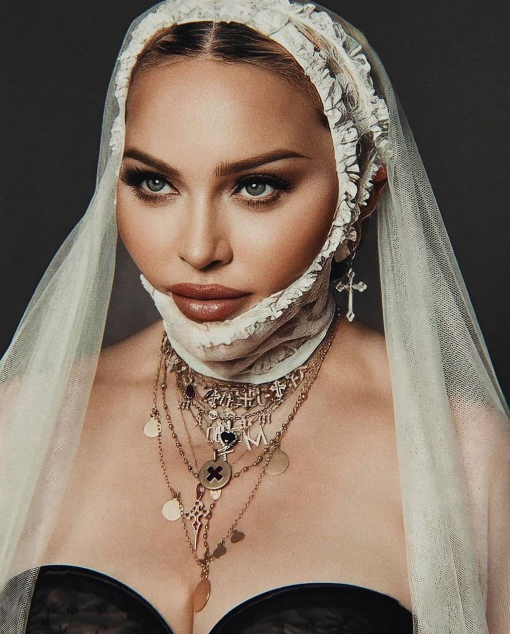 Madonna wearing a Hanut Singh cross pendant earring. Photo: @madonna/instagram Madonna wearing a Hanut Singh cross pendant earring. Photo: @madonna/instagram