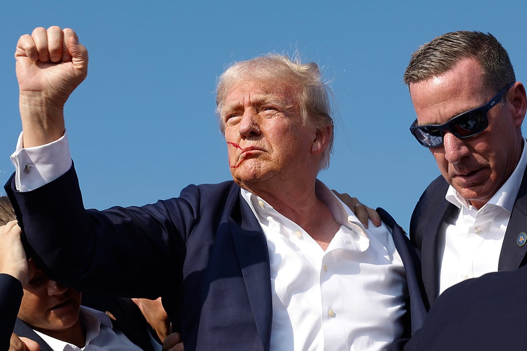 Republican presidential candidate Donald Trump pumps his fist as he is rushed offstage by Secret Service agents after being grazed by a bullet during a campaign rally on Saturday in Butler, Pennsylvania. Photo: TNS Republican presidential candidate Donald Trump pumps his fist as he is rushed offstage by Secret Service agents after being grazed by a bullet during a campaign rally on Saturday in Butler, Pennsylvania. Photo: TNS