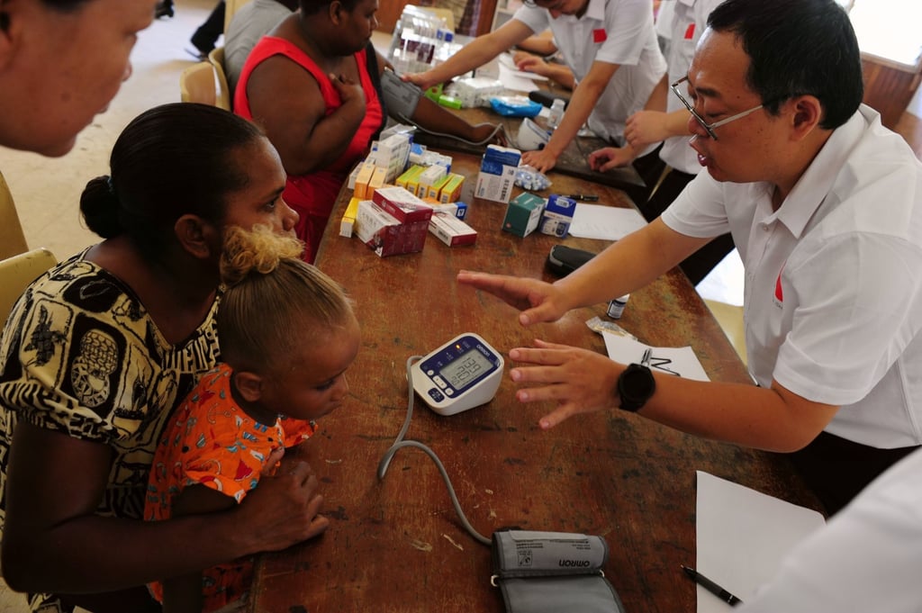 A member of a Chinese medical team offers health consultations to residents in Honiara, Solomon Islands, last month. Photo: Xinhua