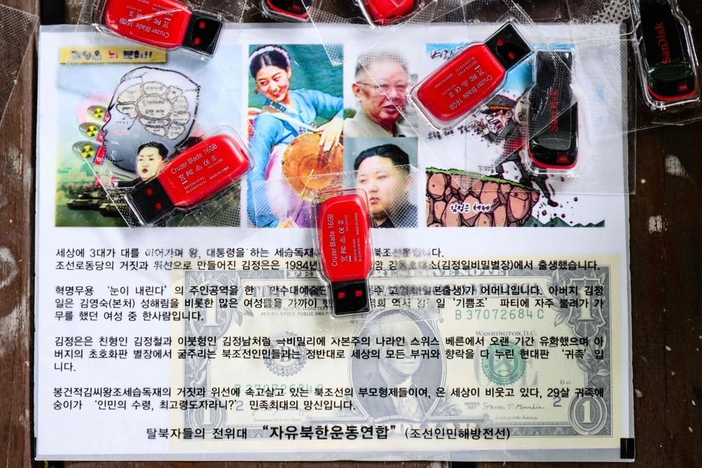 A sample leaflet containing a US dollar bill and USB-drives of K-pop that a North Korean defector regularly floats via propaganda balloons into his homeland. Photo: AFP A sample leaflet containing a US dollar bill and USB-drives of K-pop that a North Korean defector regularly floats via propaganda balloons into his homeland. Photo: AFP