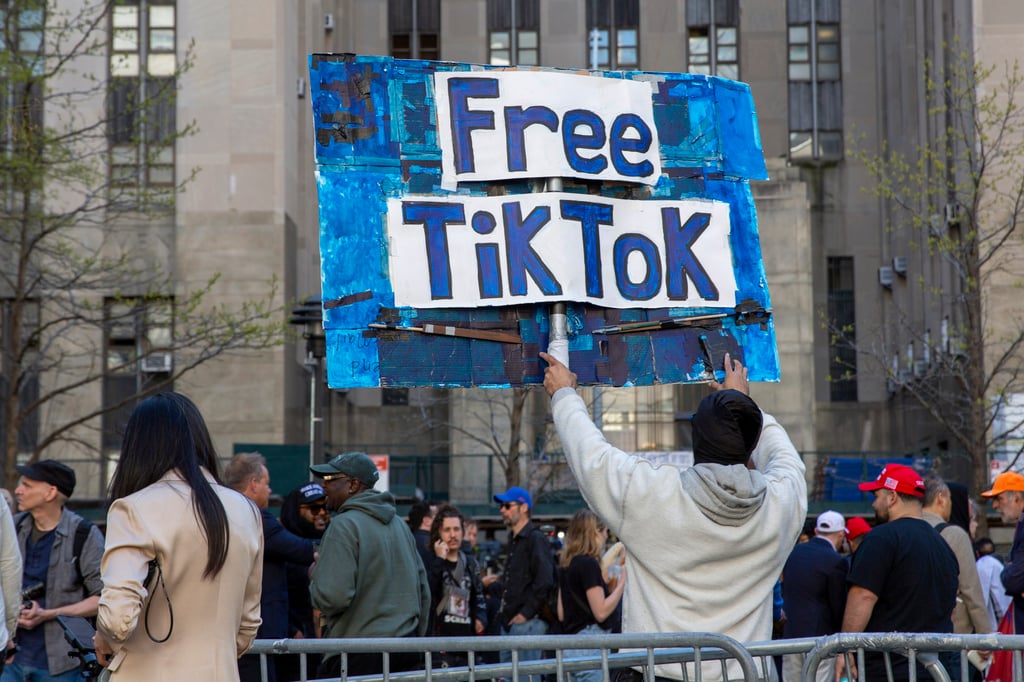 A man carries a Free TikTok sign in front of the courthouse where the hush-money trial of Donald Trump got underway April 15, 2024, in New York City. Photo: AP