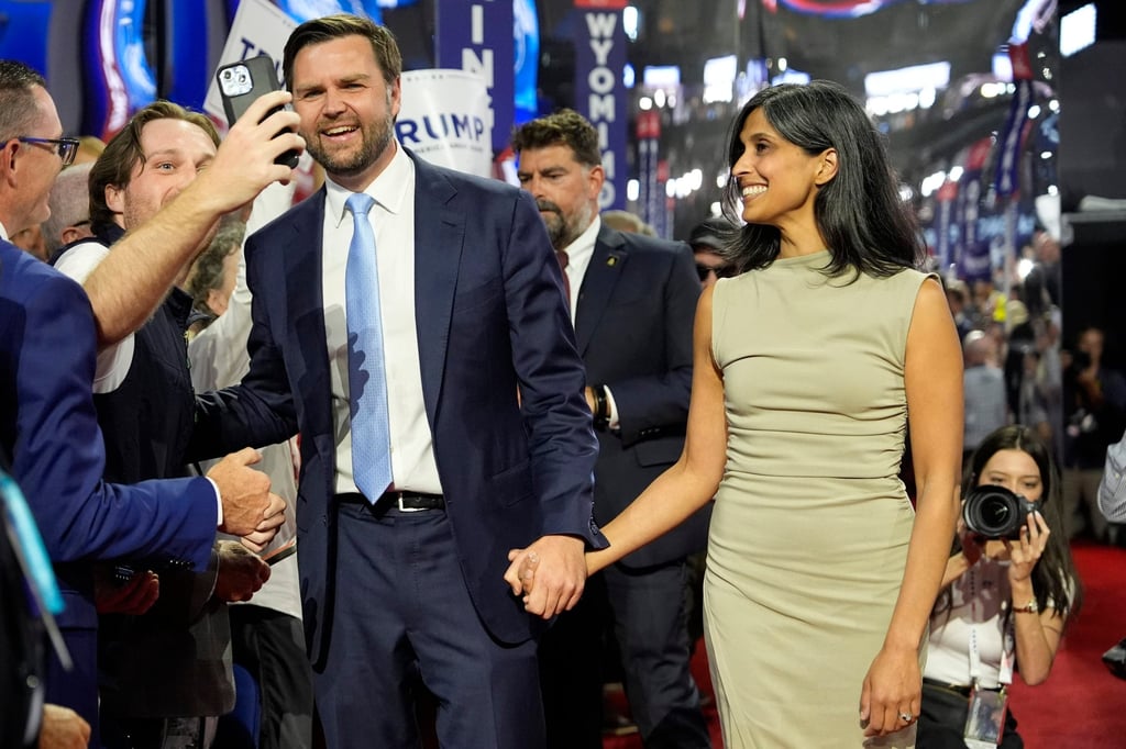 Republican US vice-presidential candidate J.D. Vance and his wife Usha Chilukuri Vance arrive on the floor during the first day of the Republican National Convention in Milwaukee on Monday. Photo: AP Republican US vice-presidential candidate J.D. Vance and his wife Usha Chilukuri Vance arrive on the floor during the first day of the Republican National Convention in Milwaukee on Monday. Photo: AP