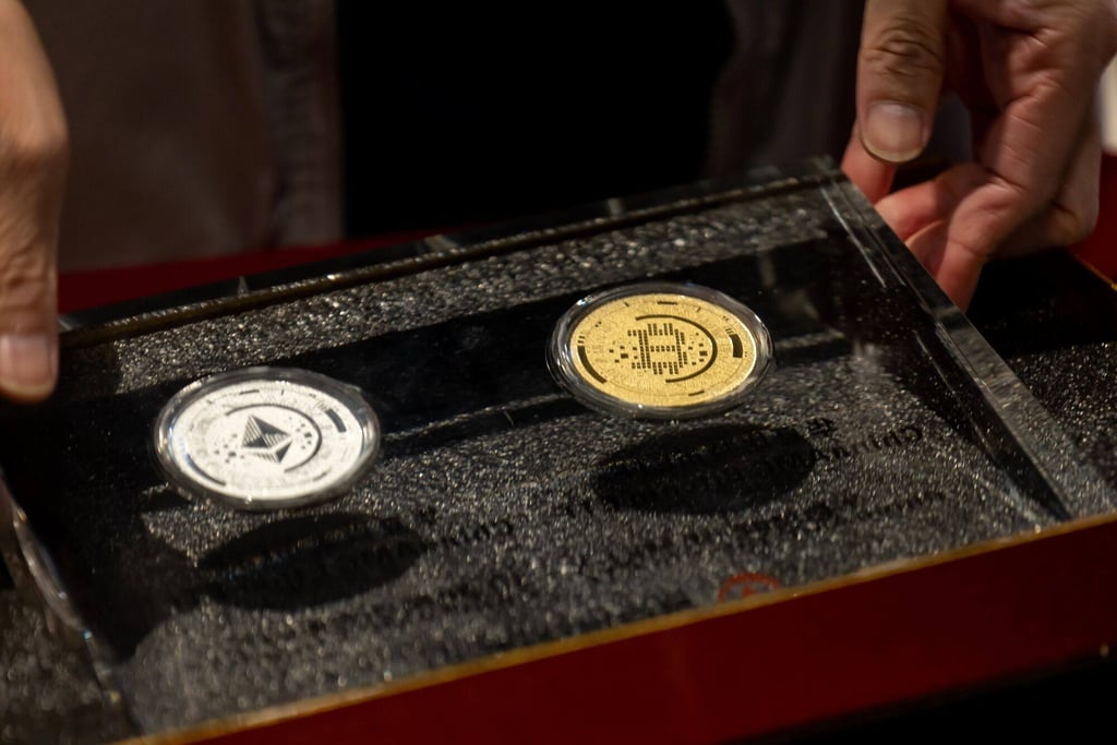 Physical representations of bitcoin and ether tokens are presented during the listing ceremony of the spot cryptocurrency ETFs issued by China Asset Management at the Hong Kong stock exchange on April 30, 2024. Photo: Bloomberg