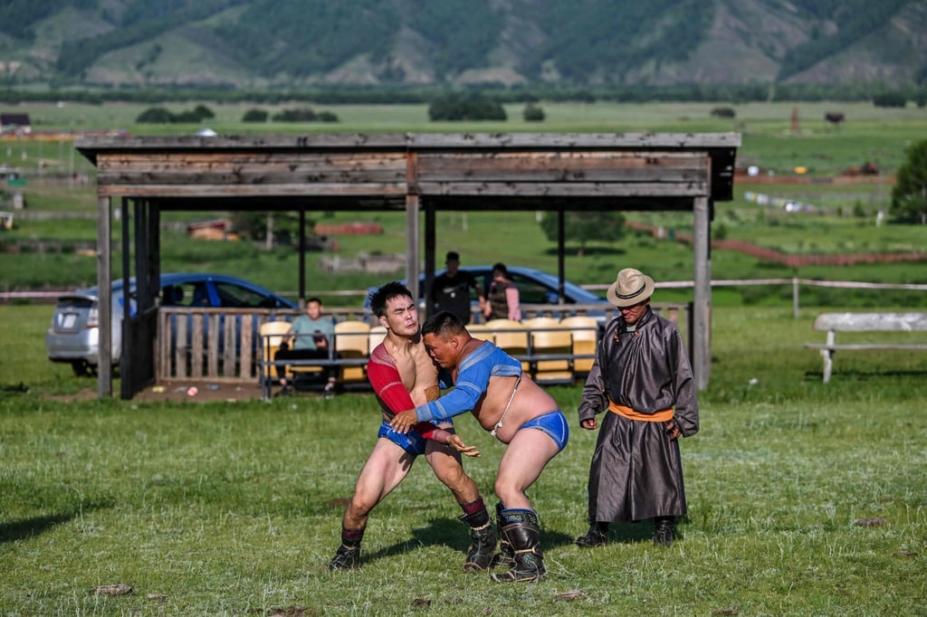 Men compete during a wrestling match ahead of the Naadam festival in Mongolia. Photo: AFP