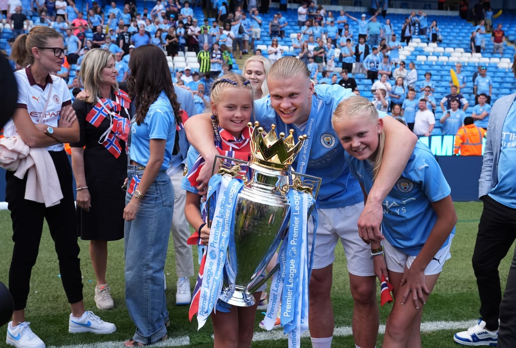 Manchester City’s Erling Haaland celebrates with the Premier League trophy with family and friends at the Etihad Stadium. Photo: DPA Manchester City’s Erling Haaland celebrates with the Premier League trophy with family and friends at the Etihad Stadium. Photo: DPA