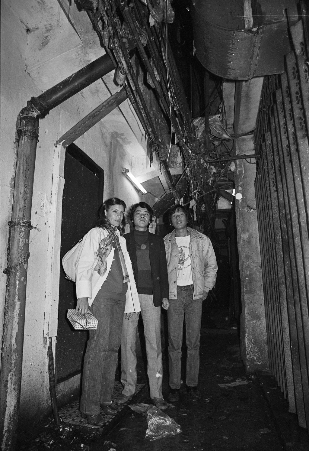 Jackie Pullinger (left), who helped heroin addicts and other down-and-out youngsters in Kowloon Walled City, with Ah Bui (centre), a former drug addict, and a friend in the Walled City in 1982. Photo: SCMP